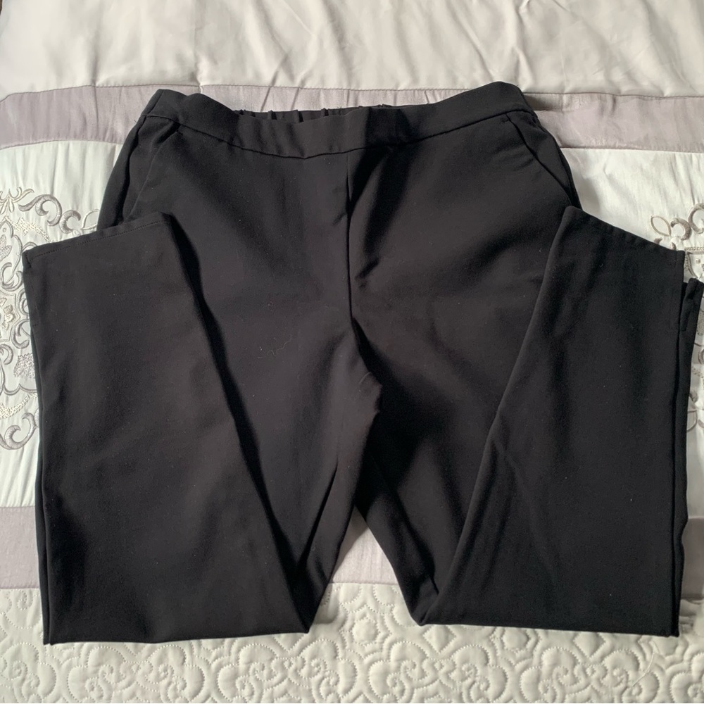 Comfortable black pants with pockets and double slit at ankle